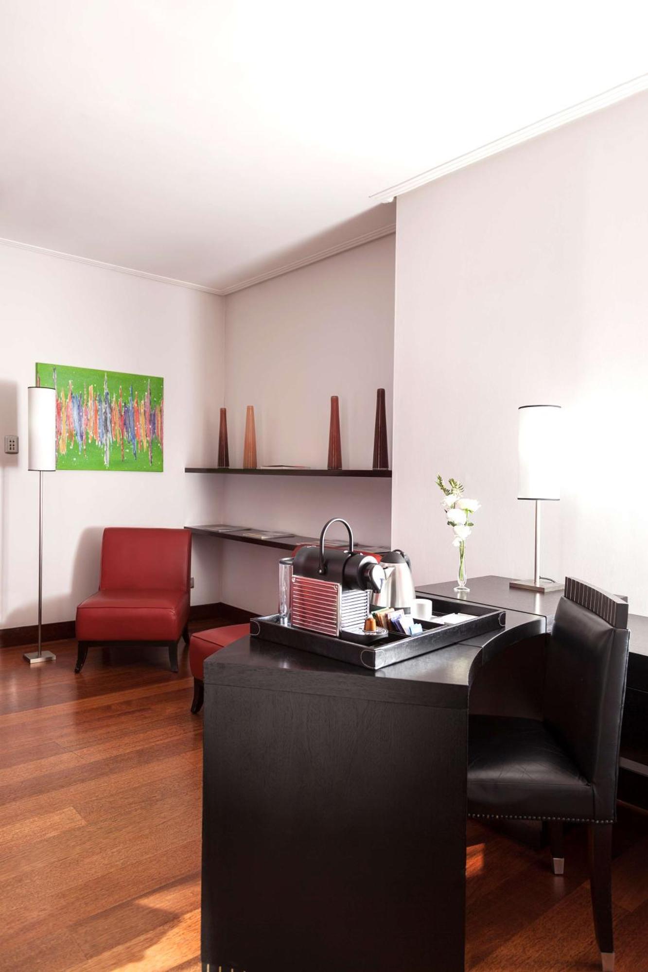 Nh City Buenos Aires Exterior photo A Nespresso machine in a hotel room